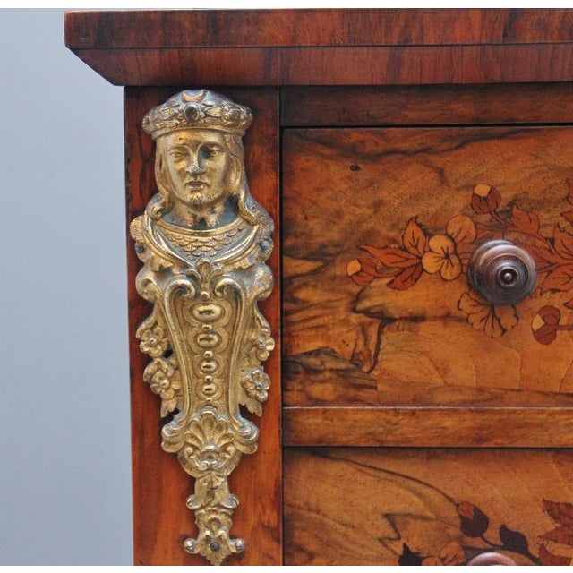 A fabulous quality 19th walnut and marquetry Wellington chest, the shaped and moulded cornice decorated with floral...
