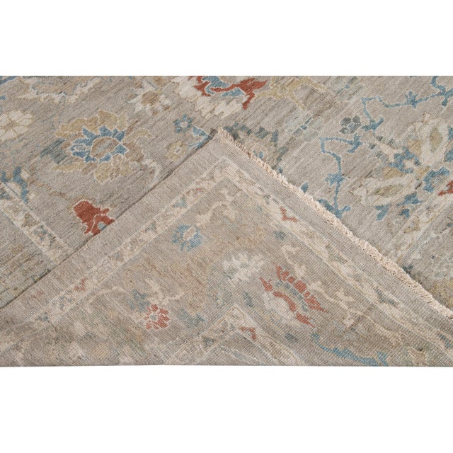 Beautiful modern Sultanabad hand knotted wool rug with a gray field. This Sultanabad rug has a multi-color accent in a...