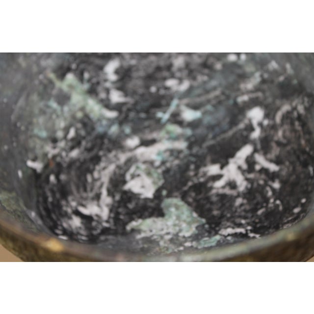 Antique Chinese Bronze Tripod Censer with Three Foo Lions and Ornate Detailing A striking and richly detailed antique...