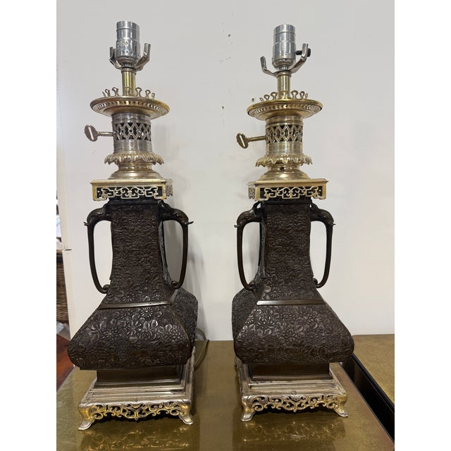 This matched pair of table lamps appears to have begun life as late 19th century East Asian oil lamps, later electrified,...