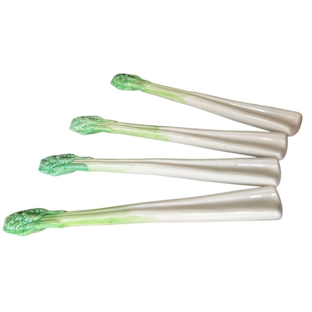 A playful and highly collectible set of four Italian ceramic celery stalk swizzle sticks, beautifully modeled with crisp...
