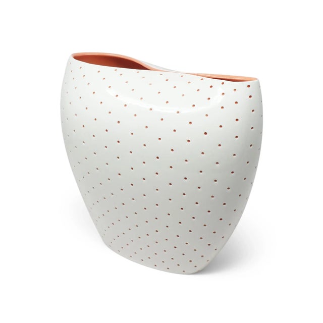 A captivating porcelain vase from the ALDO collection, designed by the acclaimed architectural firm Studio Fuksas for...