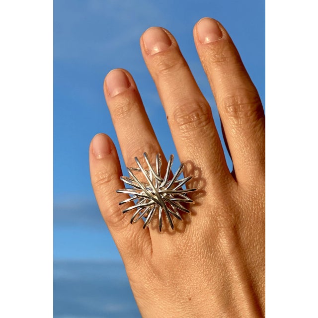 Striking silver ring by Anders Högberg, in an imaginative design. A nest of of silver strings form a voluminous circular...