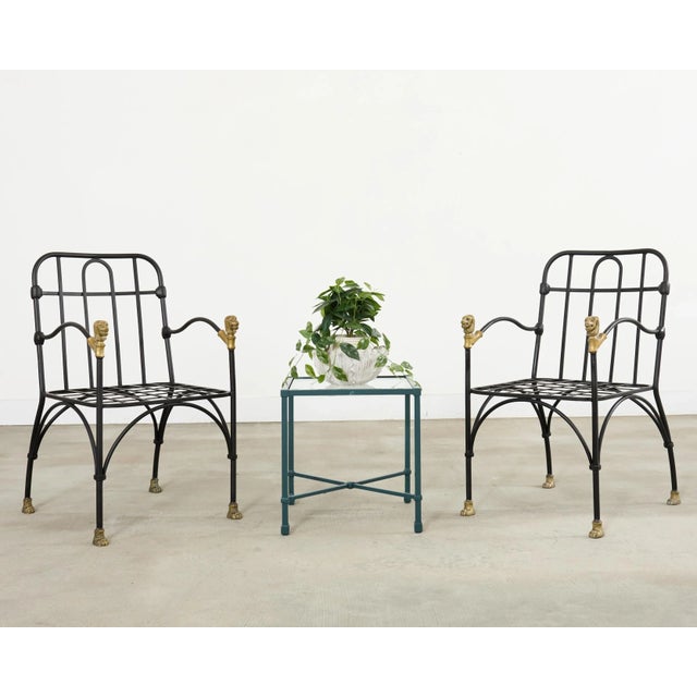 Rare and opulent set of four iron patio and garden dining chairs after Diego Giacometti. The iconic mid-century modern...
