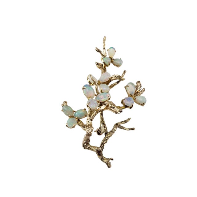 12 Karat Yellow Gold and Opal Floral Brooch- Bursting with natural elegance, this vintage brooch is crafted in 12K yellow...