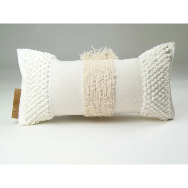 The Furry Mushroom cover pillow in white is made of recycled cotton and linen from the waste of home textile products. As...