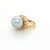 This exquisite cocktail ring is crafted in solid 14k yellow gold and features a bold, elegant design. At the center rests...
