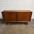 A vintage Danish teak Model 19 sideboard designed by Gunni Omann for Omann Jun, dating to the 1960s. The long cabinet is...