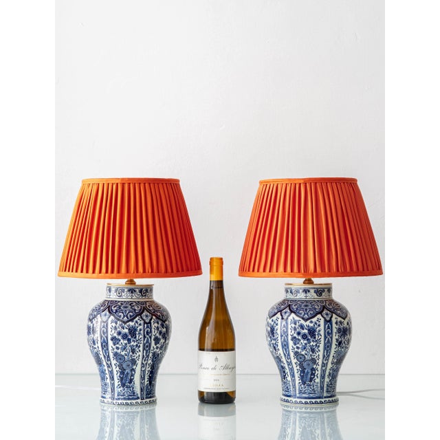 A pair of navy blue andwhite Delft vases from the Netherlands, produced by Boch under the Royal Sphinx name during the...