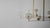 Three illuminated glass globes orbit a central gravitational axis. Rotating brass arms evoke the mechanical grace of the...
