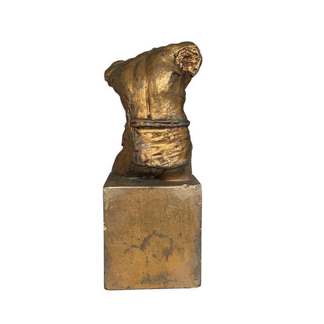 An exquisite gold sculpture of a male nude torso in the Classical style, executed in the manner of Joseph Addotta....