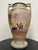 Antique Japanese Nippon hand-painted porcelain vase with a desert landscape vignette, featuring a camel rider, palms, and...