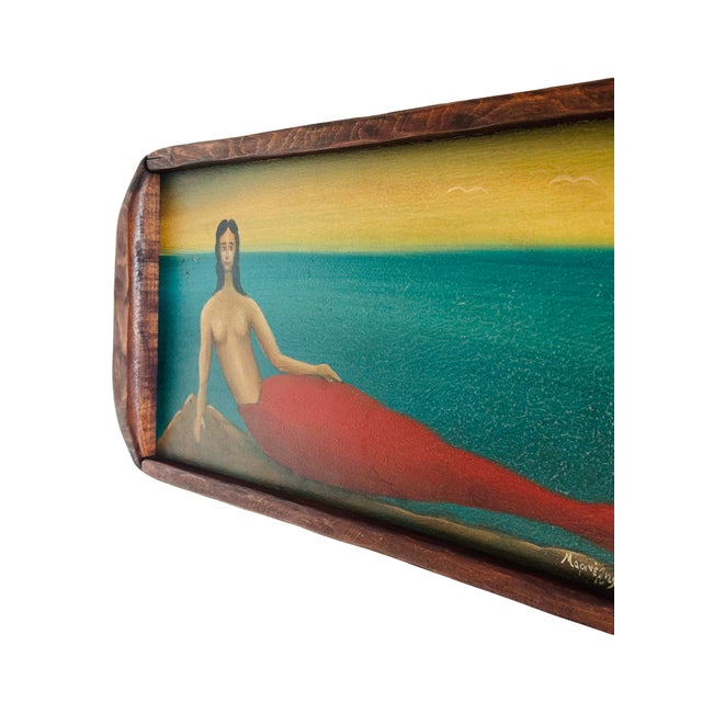 A whimsical folk art painting on a vintage wooden tray, featuring a hand-painted mermaid against a coastal sea and sky...