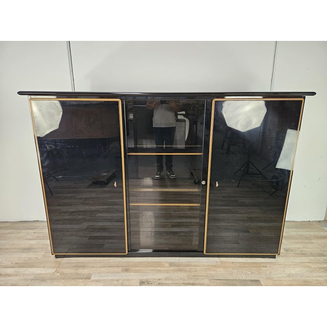 An elegant and rare Pierre Cardin sideboard from the 1970s, featuring a sophisticated and dramatic design, typical of the...