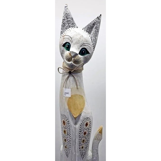 Cute as a button a hand carved wooden cat statue from west Africa, Ghana likely. Whitwash paint with gilded highlights,...