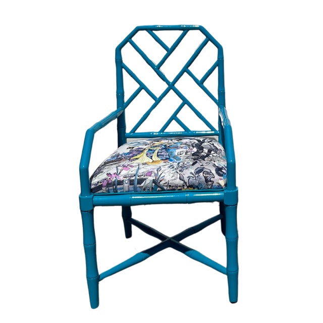 This bold Asian-inspired vintage set includes a chair and side table crafted from rosewood with faux bamboo detailing,...