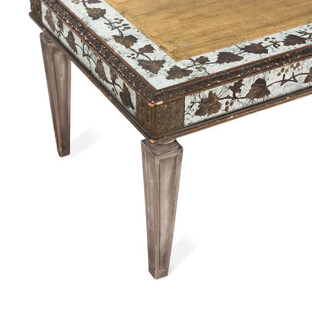 A refined painted and églomisé low cocktail table in the style of Maison Jansen, late 20th century. The rectangular form...