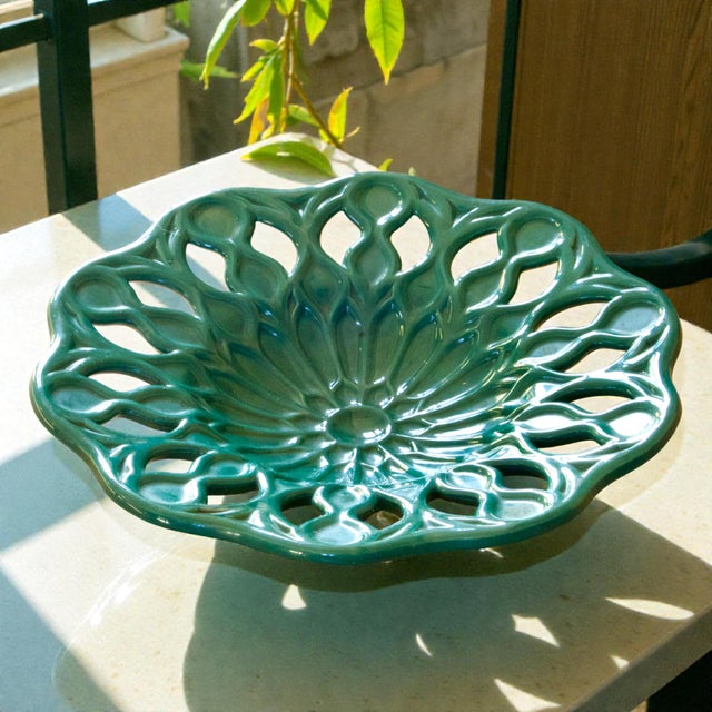 Large and beautiful vintage openwork earthenware bowl/fruit basket in dark green. Geometric mandala design in relief. A...