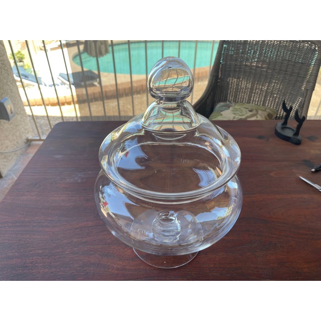 Here is a really nice blown glass jar with lid. Love the fine beveled edge on the component bottom. There are on chips or...