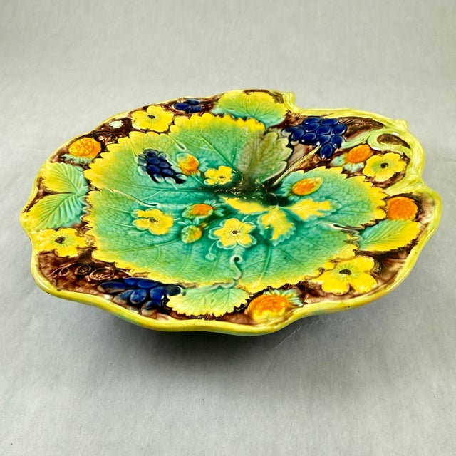 A majolica glazed leaf form dessert tray from Samuel Alcock & Co, Burslem, Staffordshire, England, circa 1850. A central...
