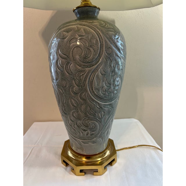 Beautiful oriental celadon crackle table lamp with brass base. Circa Late 20th Century.