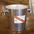 Crafted in France circa 1970, this vintage champagne ice bucket was made for the celebrated Champagne house G.H. Mumm of...