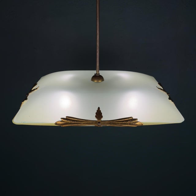 Amazing rare chandelier made in italy in the 1930s. greenish glass, bright brass details. vintage chandelier is good...