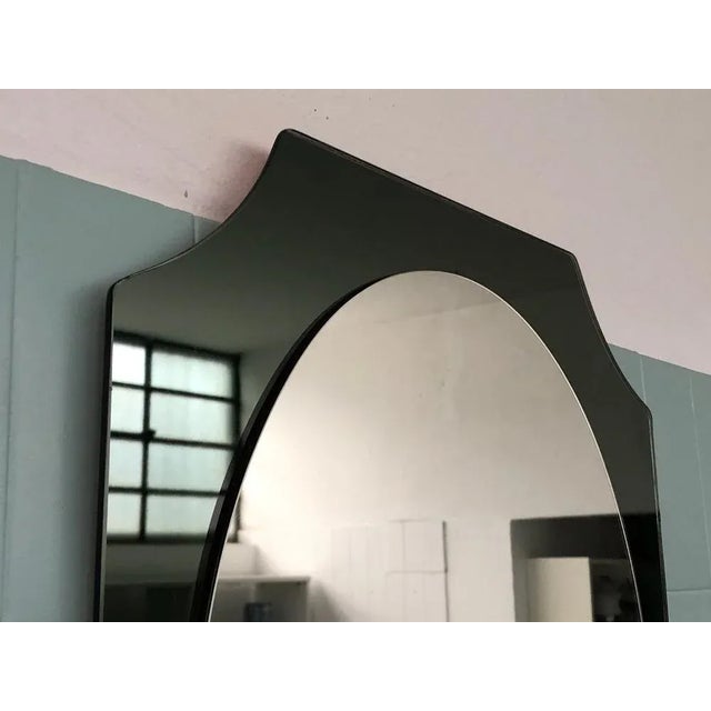 Mirror conceived by Antonio Lupi and produced by the Cristal Luxor in the 70s All in glass with smoke glass frame....