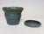Studio ceramic planter with drainage hole and saucer/plate by ceramicist, Deanna Nichols (b. 1942-2017, Missouri). Holding...