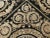High-quality hand knotted, Savonnerie carpet. Black and gold rug in wool pile on cotton foundation; featuring an ornate...