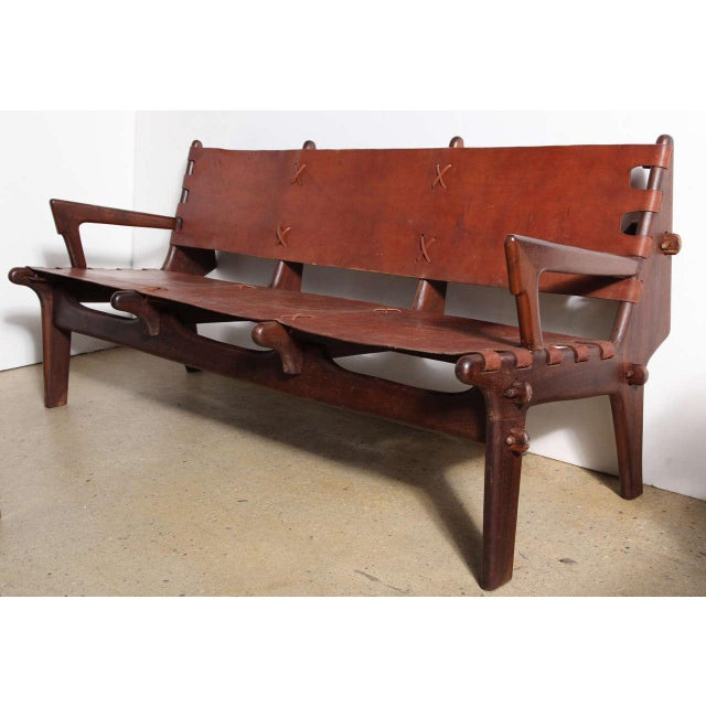 Angel Isaac Pazmino for Muebles de Estilo Solid Rosewood & Brown Leather Sofa, early 1960s. Featuring sturdy rosewood peg...