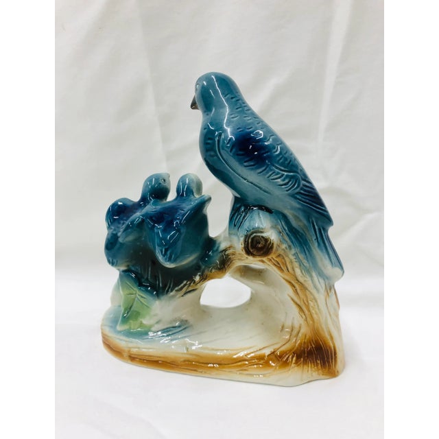 Blue bird family perched on a branch finished in gloss glaze.