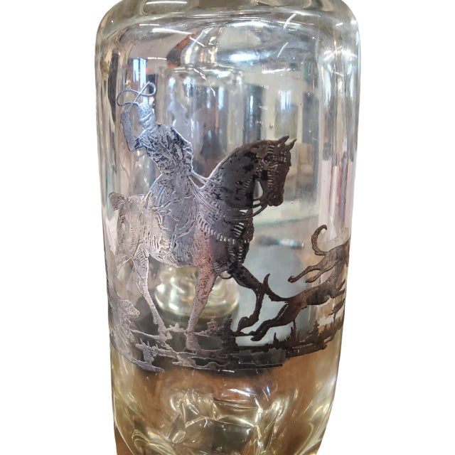 A lovely pair of equestrian themed decanters probably attributable to the Rockwell Silver Co.. They measure 11 inches tall...