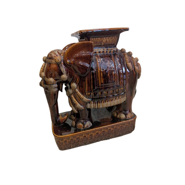 Fabulous with his high-gloss root-beer finish, this vintage ceramic elephant plant stand is very handsome indeed....