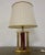 Hollywood Regency style table lamp. Red and brass lacquered lampshade with fauna decorations. The lamp is Hollywood...