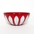 An original 11-inch Cathrineholm enameled steel bowl featuring the iconic white Lotus pattern against a vibrant red...