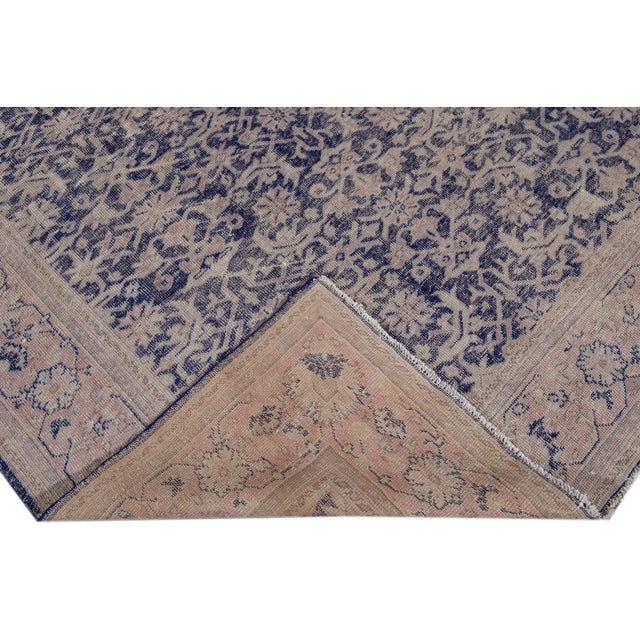 Beautiful Antique Malayer hand-knotted wool rug with a purple field. This Malayer piece has a pink and beige frame and...