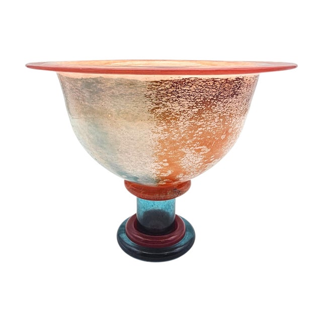 A signed art glass compote from Kosta Boda, designed by Kjell Engman as part of the Can Can series. The form is defined by...