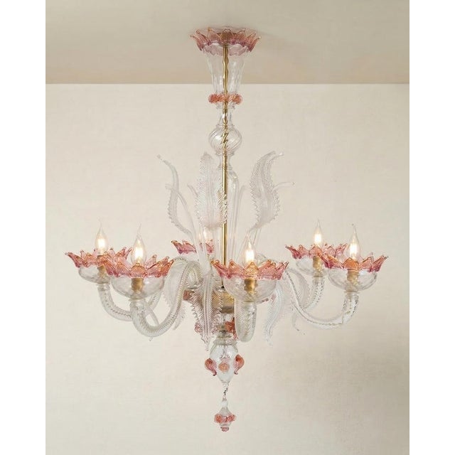 Lovely murano glass chandelier in white glass with pink and gold details, with 6 lights. discover this lovely murano glass...