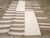This Mid-20th century Turkish Flatweave Kilim rug, showcases a bold and graphic composition that highlights the beauty of...