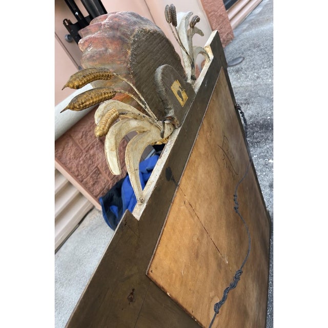 This is a wonderful carved Italian neoclassical style carved and painted shell motif mirror, it had wheat sprays flanking...