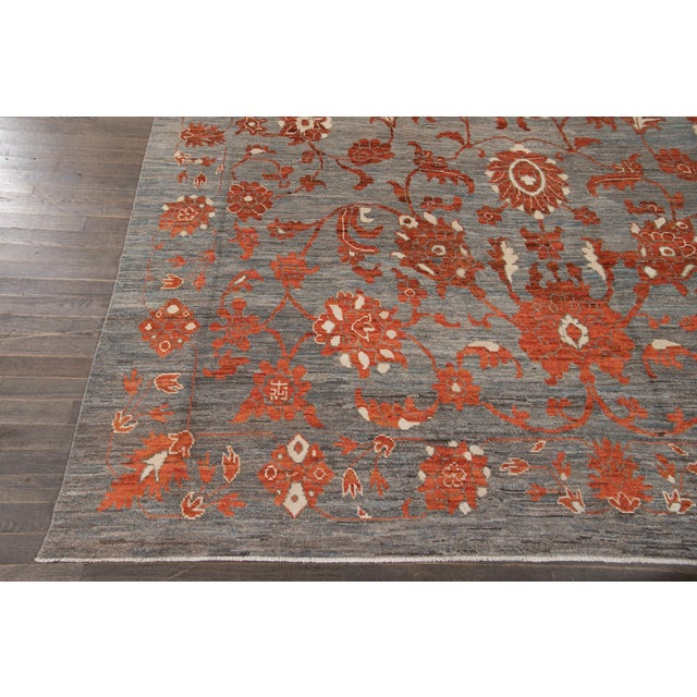Beautiful Modern oversize Oushak hand-knotted wool rug with a gray field. This Oushak rug has orange and ivory accents...