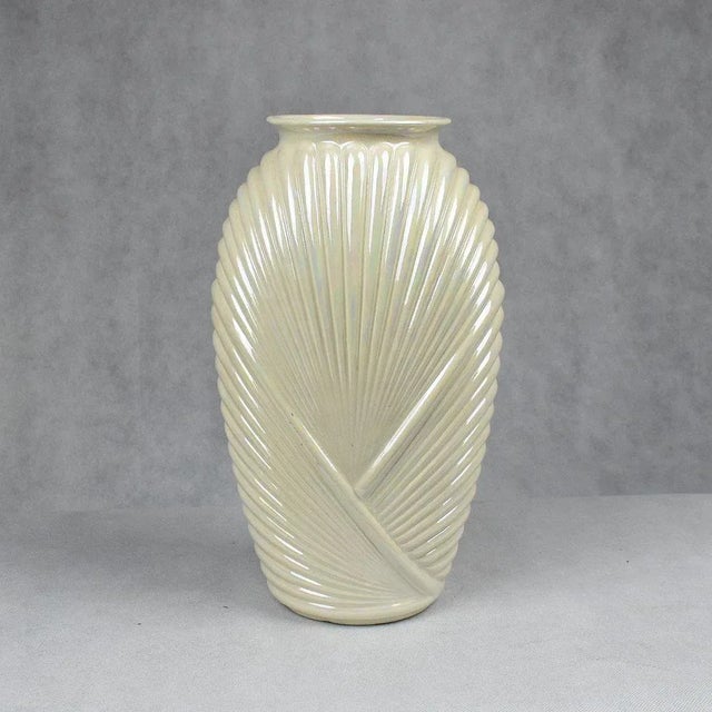 Tall pearlized white 1990’s style glass and ceramic vase in a light white pearlized finish and wonderful proportions. The...