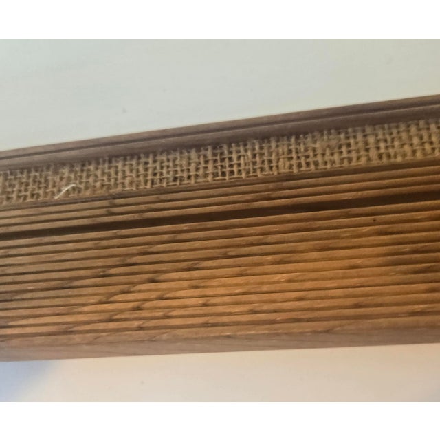 This is a very primitive frame with lots of knots, raw wood and burlap. This is a check the pictures situation. Somebody...