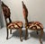 This pair of ornate, antique Italian Venetian-style side chairs (#1 of 3 available) feature extensive hand-carved details...