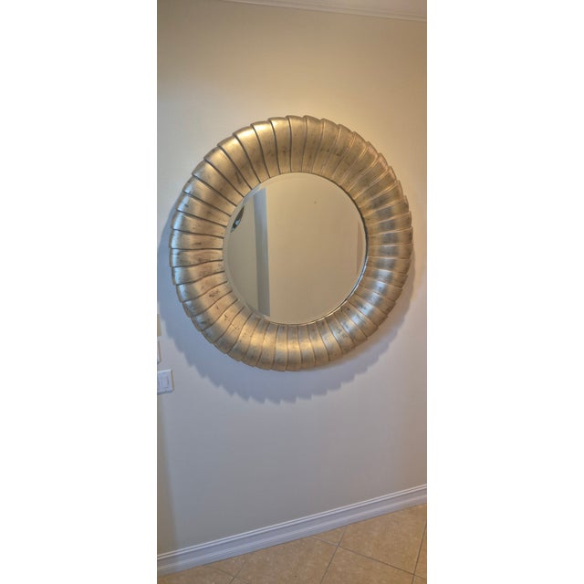 Measuring an impressive 50” in diameter, this mirror is a true statement piece. Its cascading, shell-like scallops flow...