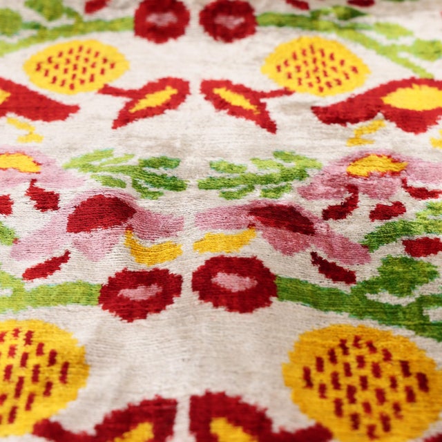 "Capture the soulful essence of artisanal heritage with this masterfully hand-knotted silk velvet ikat pillow. Measuring...
