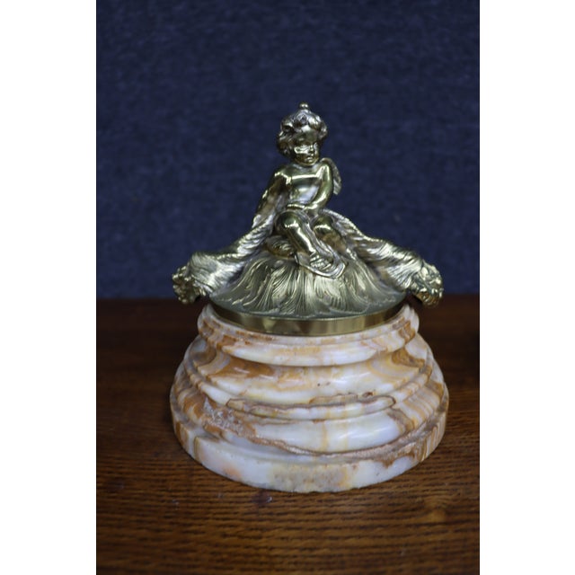 Pair of Italian decorative lidded boxes, each formed from richly veined pink and cream marble with a gilt-bronze or...