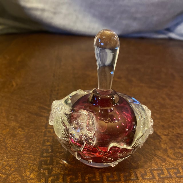 A striking, authentic hand-blown studio art glass perfume bottle by renowned American glass artist Loretta Eby. This...