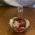 A striking, authentic hand-blown studio art glass perfume bottle by renowned American glass artist Loretta Eby. This...
